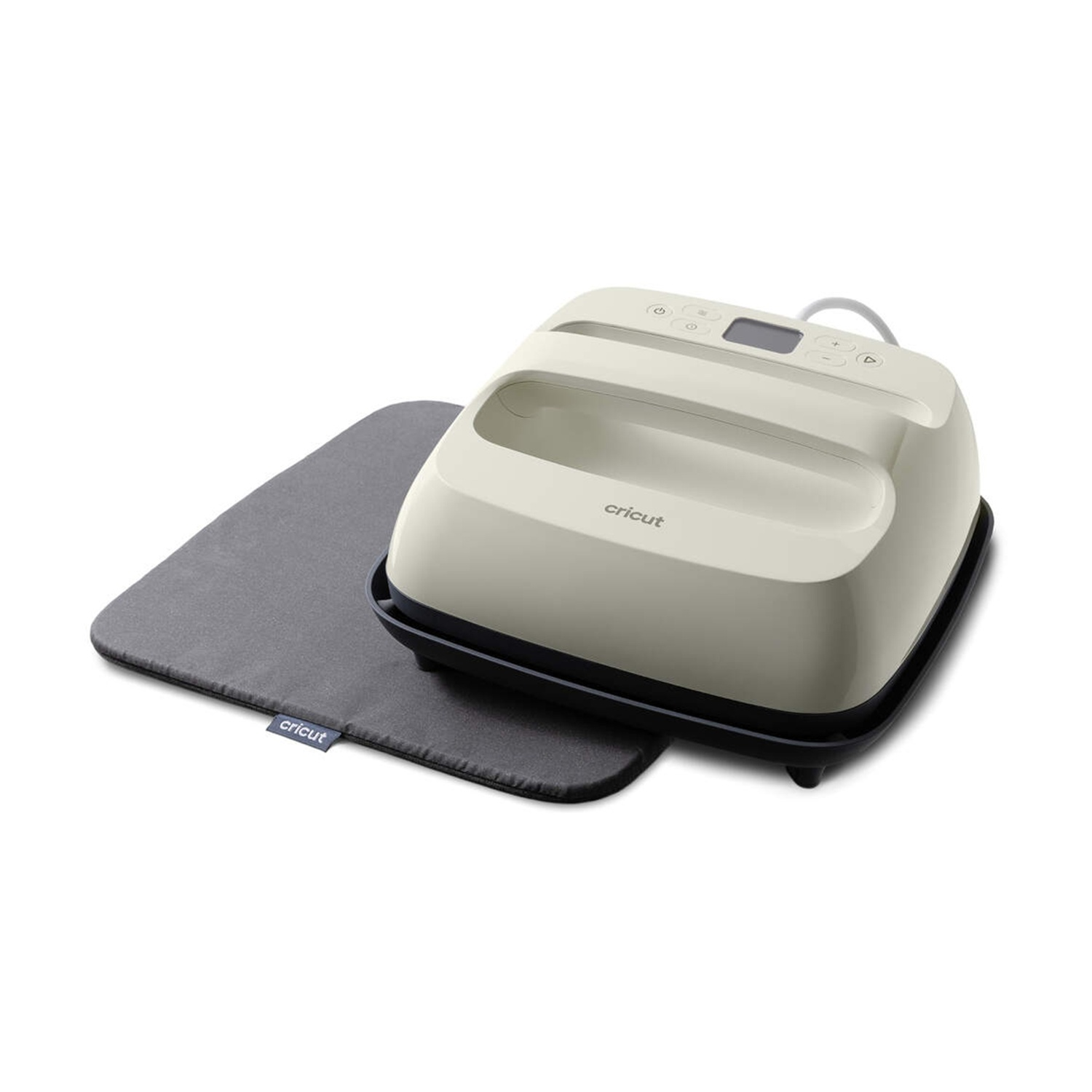 Una pressa a caldo Cricut color crema si trova su un tappetino grigio.