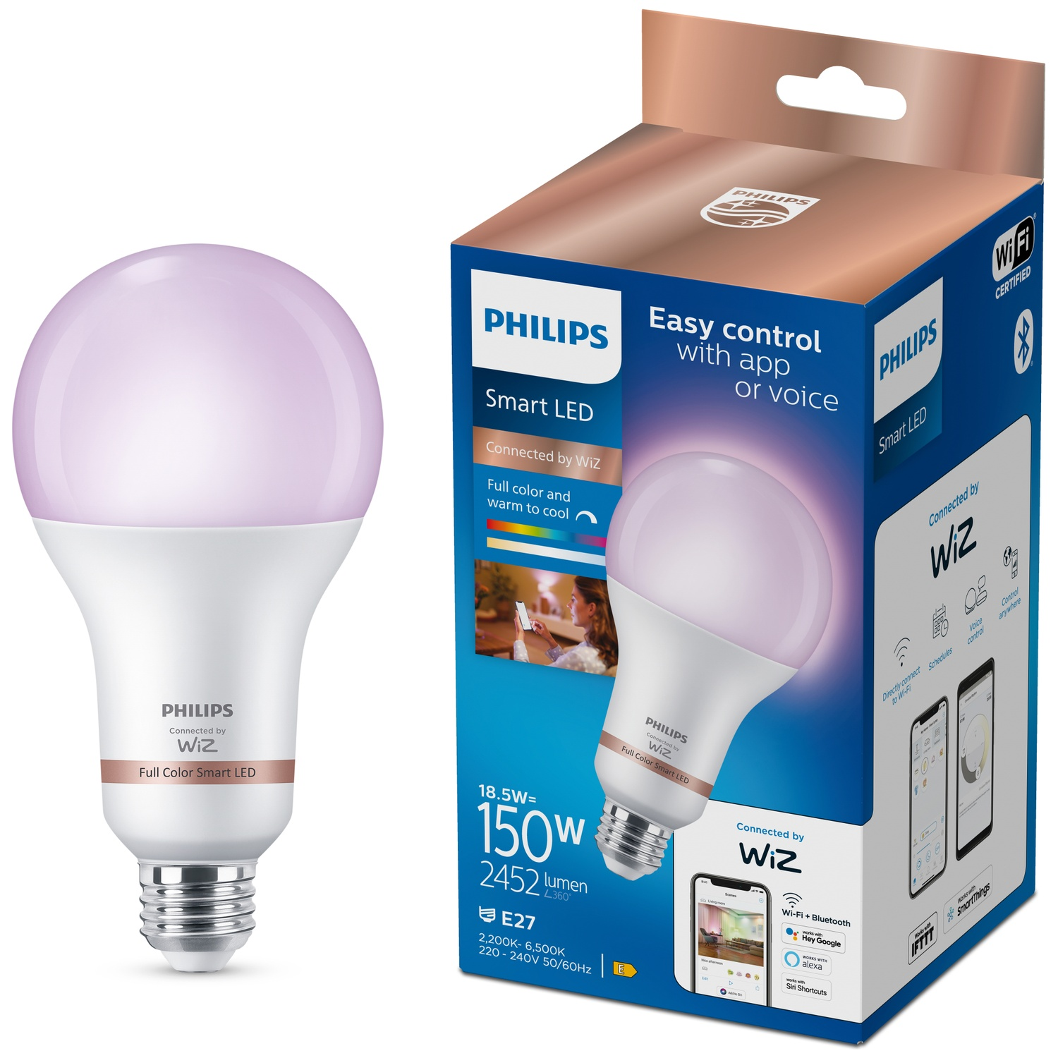 Une ampoule LED intelligente Philips brille d'une lumière rose à côté de son emballage.