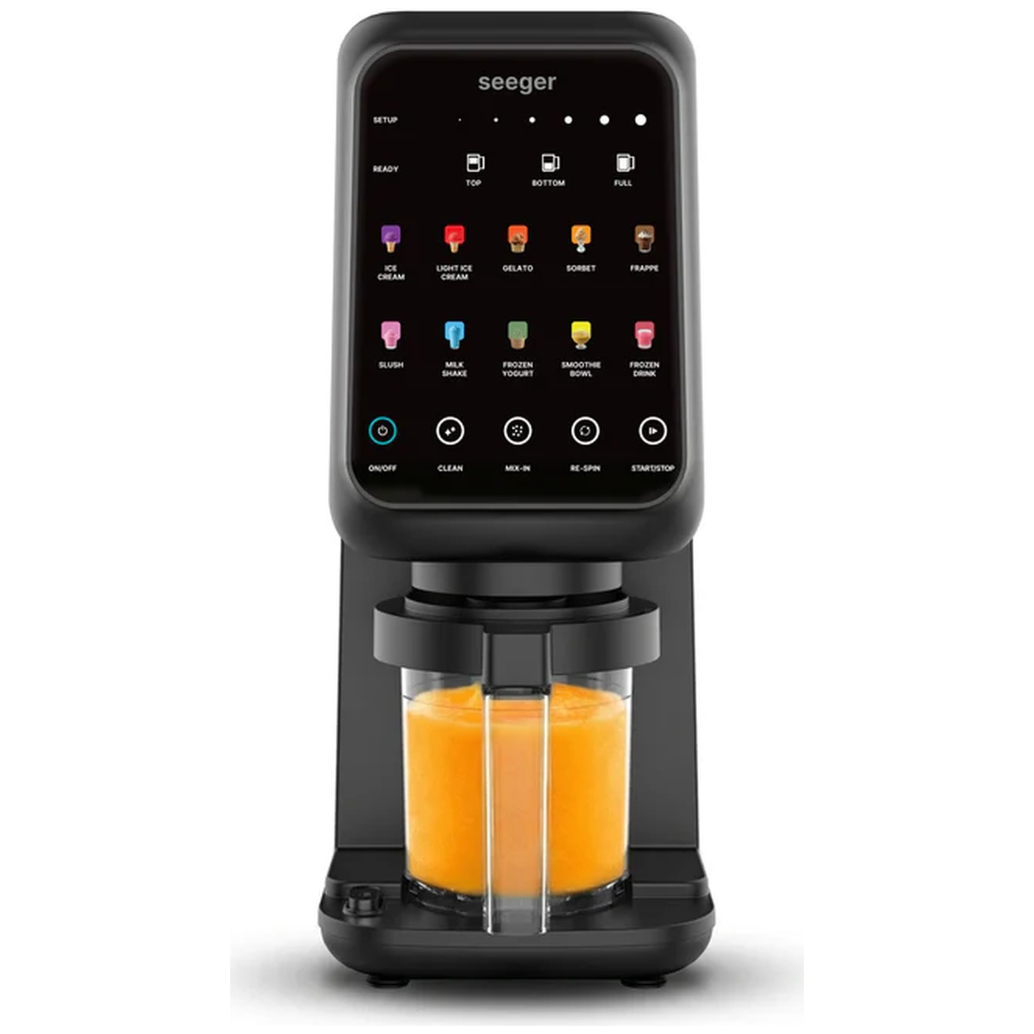 Une sorbetière Seeger noire avec un verre rempli de liquide orange.