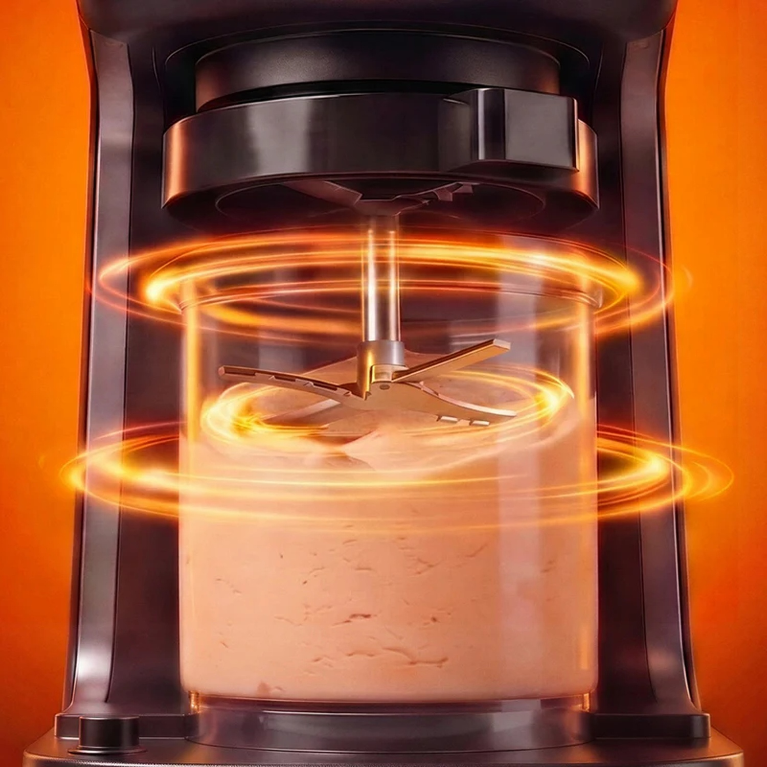 Un mixeur avec des anneaux lumineux orange mélangeant une nourriture crémeuse.