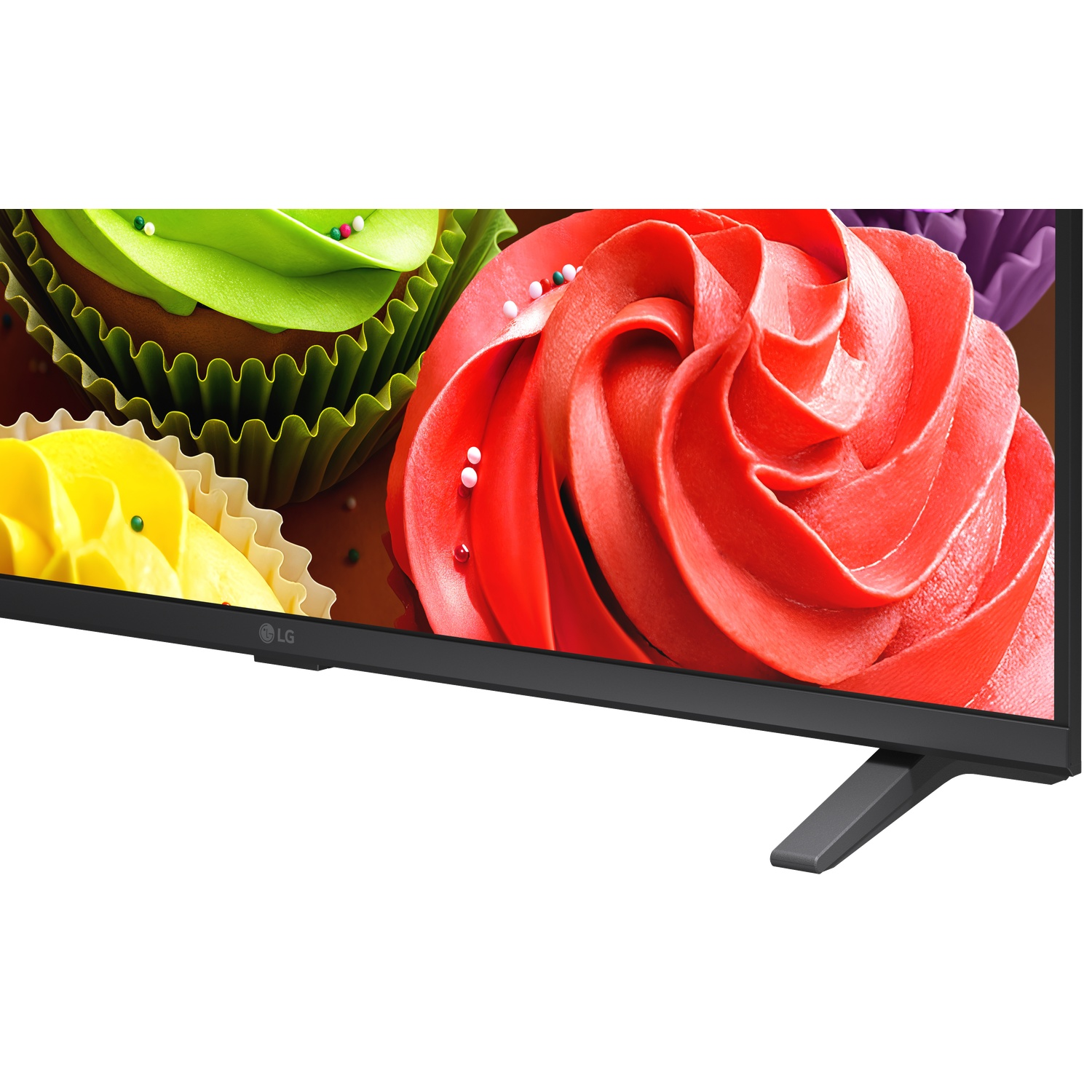 Three colorful cupcakes with frosting displayed on a television screen.