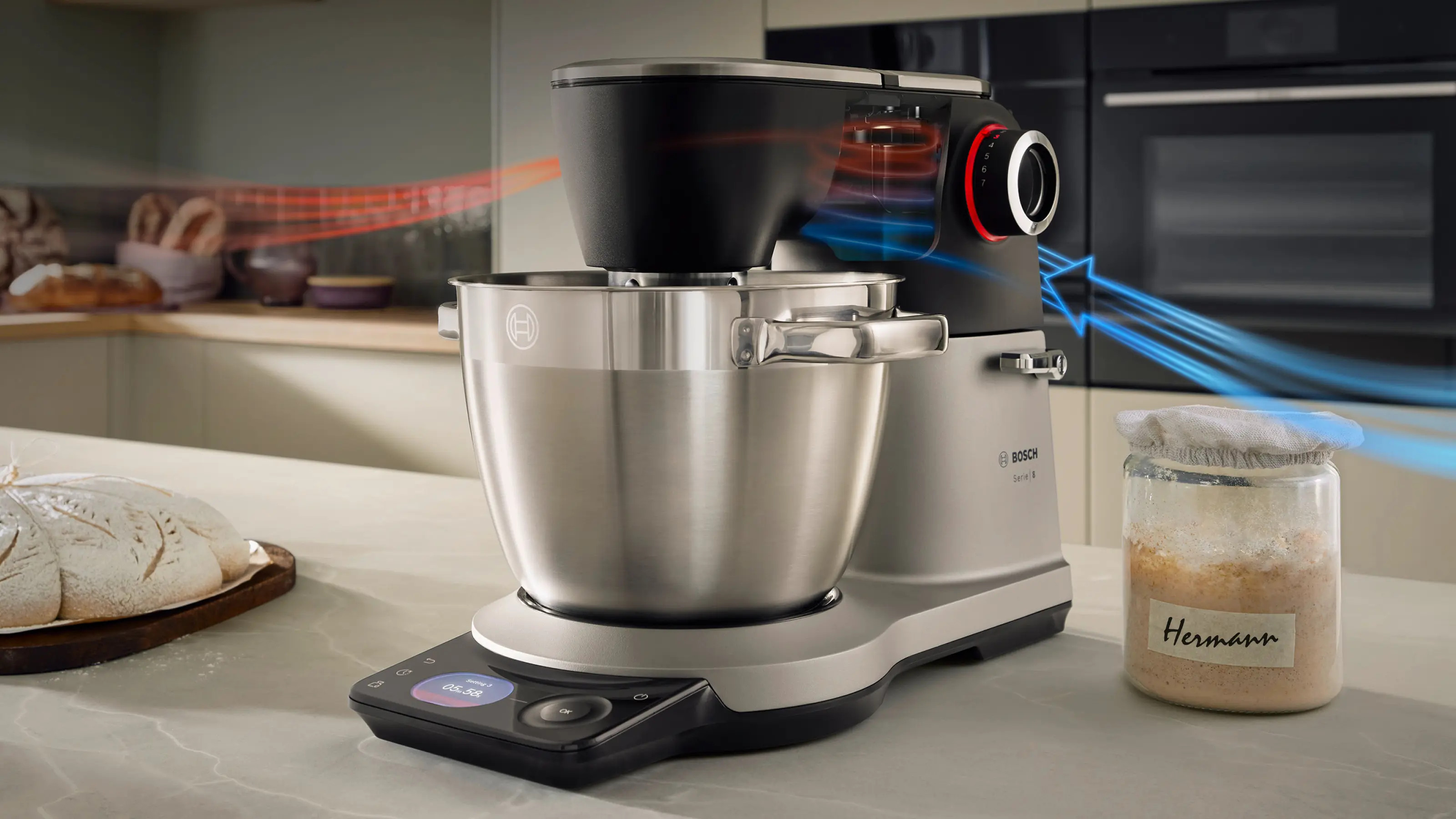Robot kuchenny z misą ze stali nierdzewnej, wyświetlaczem cyfrowym i słoikiem zakwasu.