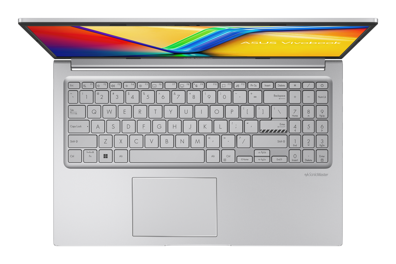 Un portátil plateado está abierto, mostrando su teclado y una pantalla de diseño colorido.