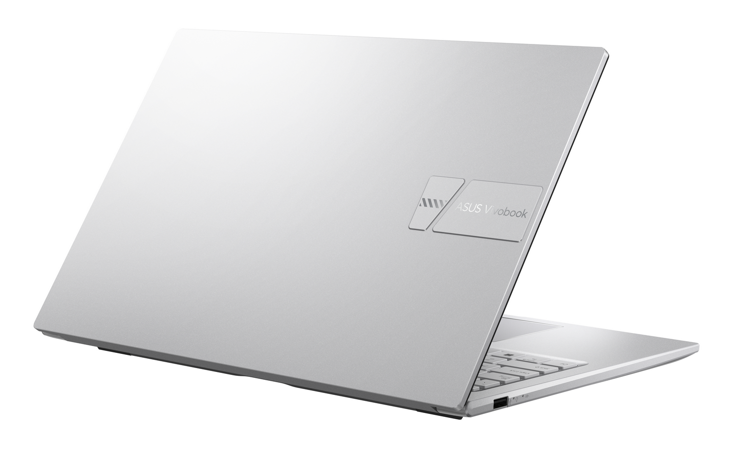 Un portátil Asus Vivobook plateado, visto desde atrás, mostrando teclado y logo.