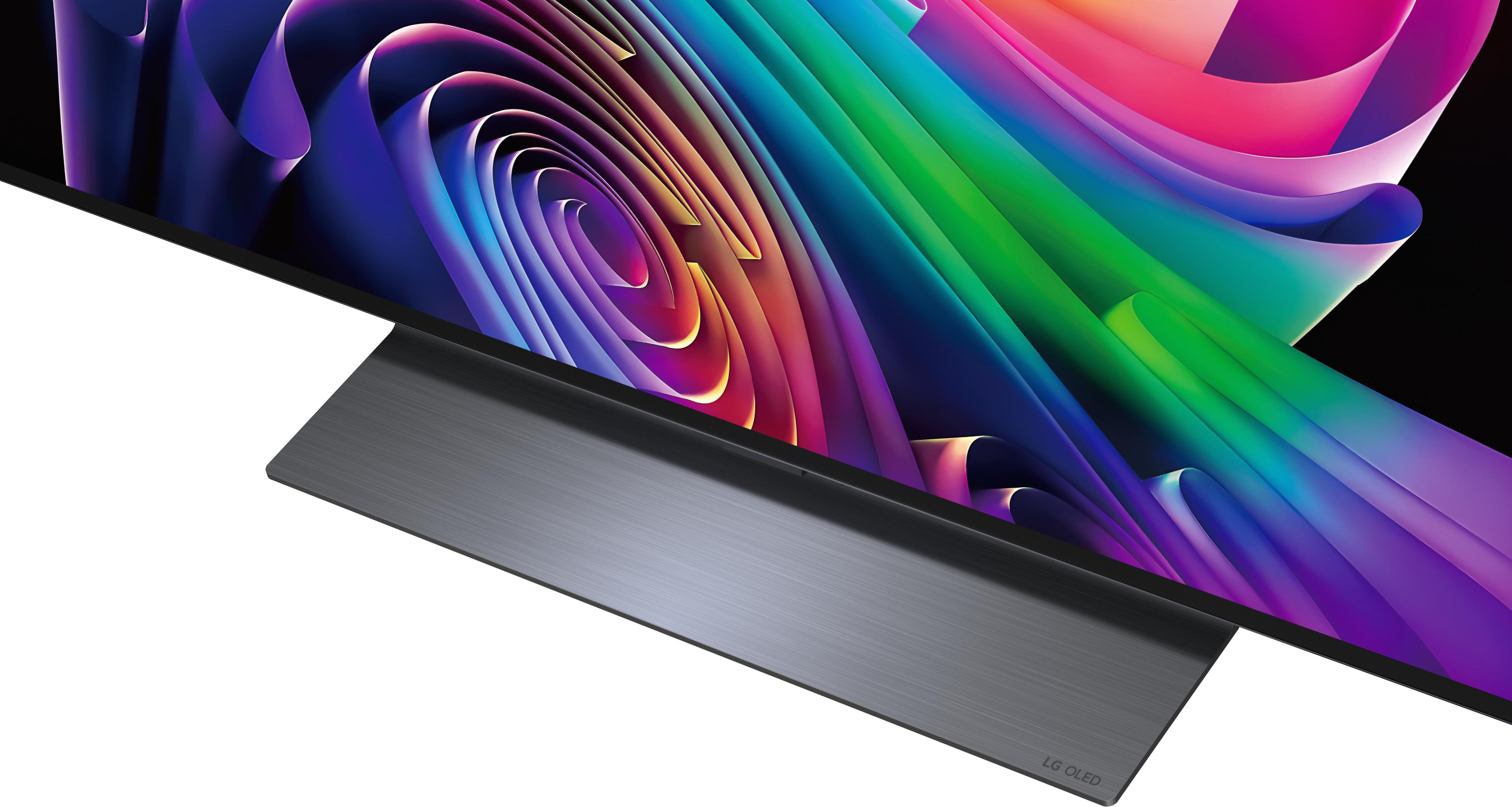 Ein moderner LG OLED Fernseher mit buntem abstrakten Bildschirm und dunklem Standfuß.