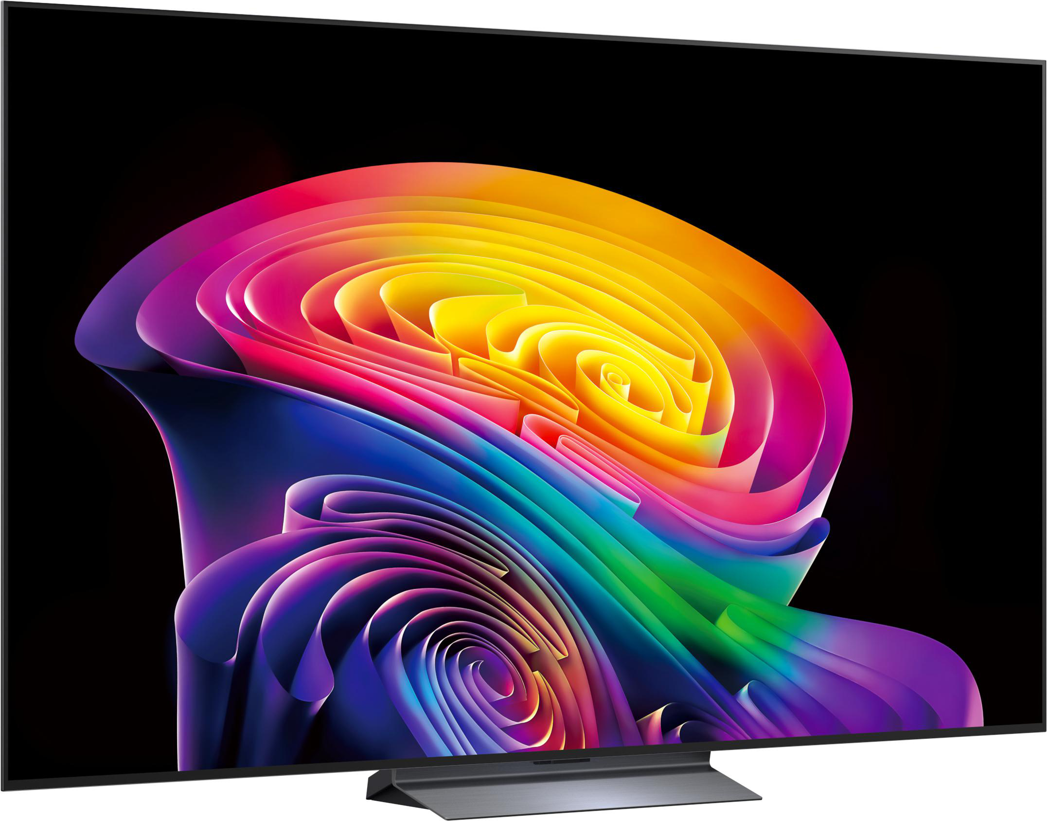 Ein moderner Fernseher zeigt ein abstraktes, wirbelndes Muster in Regenbogenfarben auf schwarzem Hintergrund.