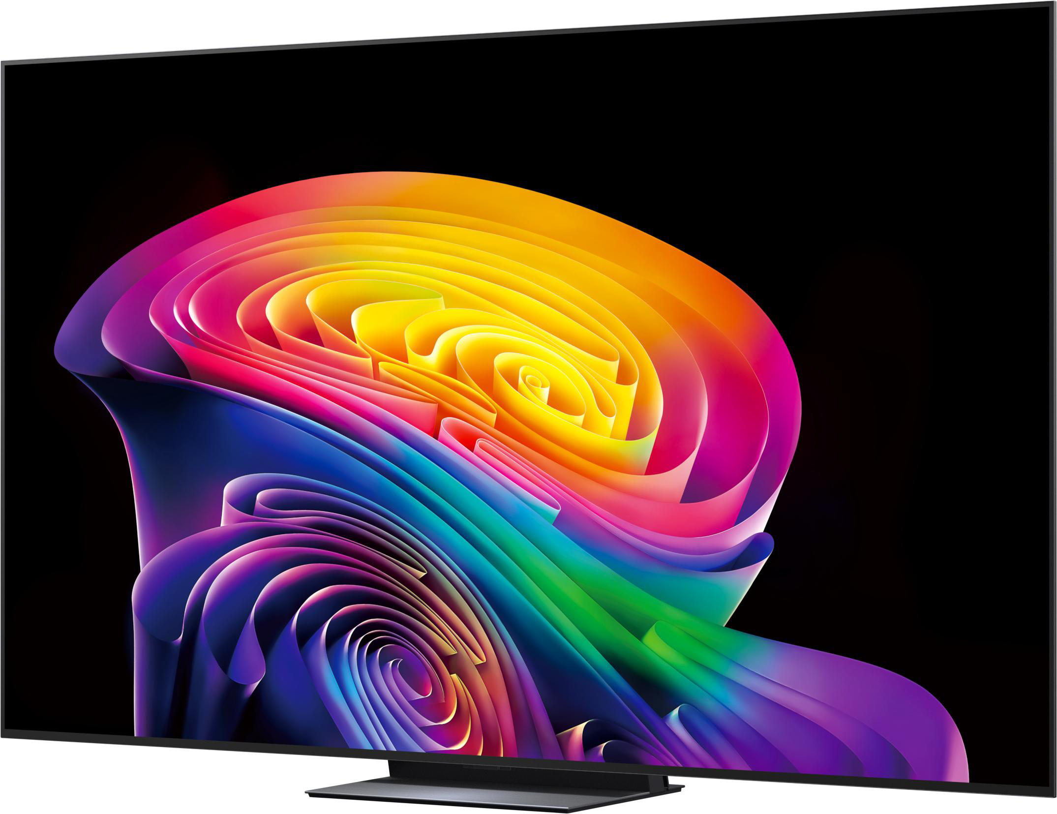 Ein moderner Fernseher zeigt einen bunten abstrakten Wirbel in Regenbogenfarben vor schwarzem Hintergrund.