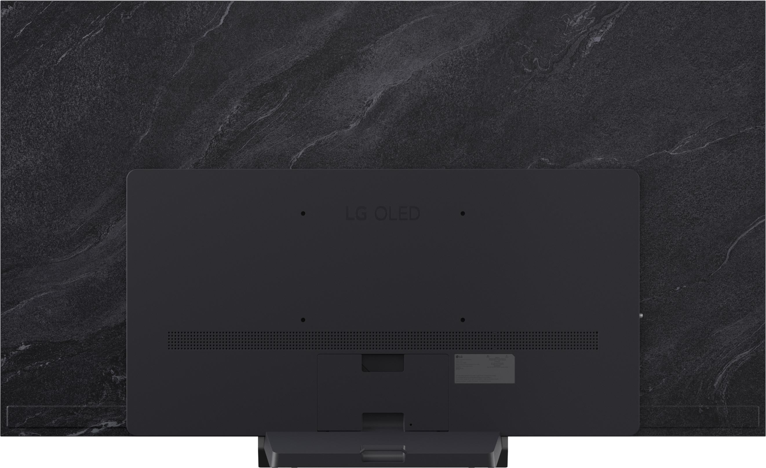 Rückseite eines schwarzen LG OLED Fernsehers mit Marmor-Design-Hintergrund.