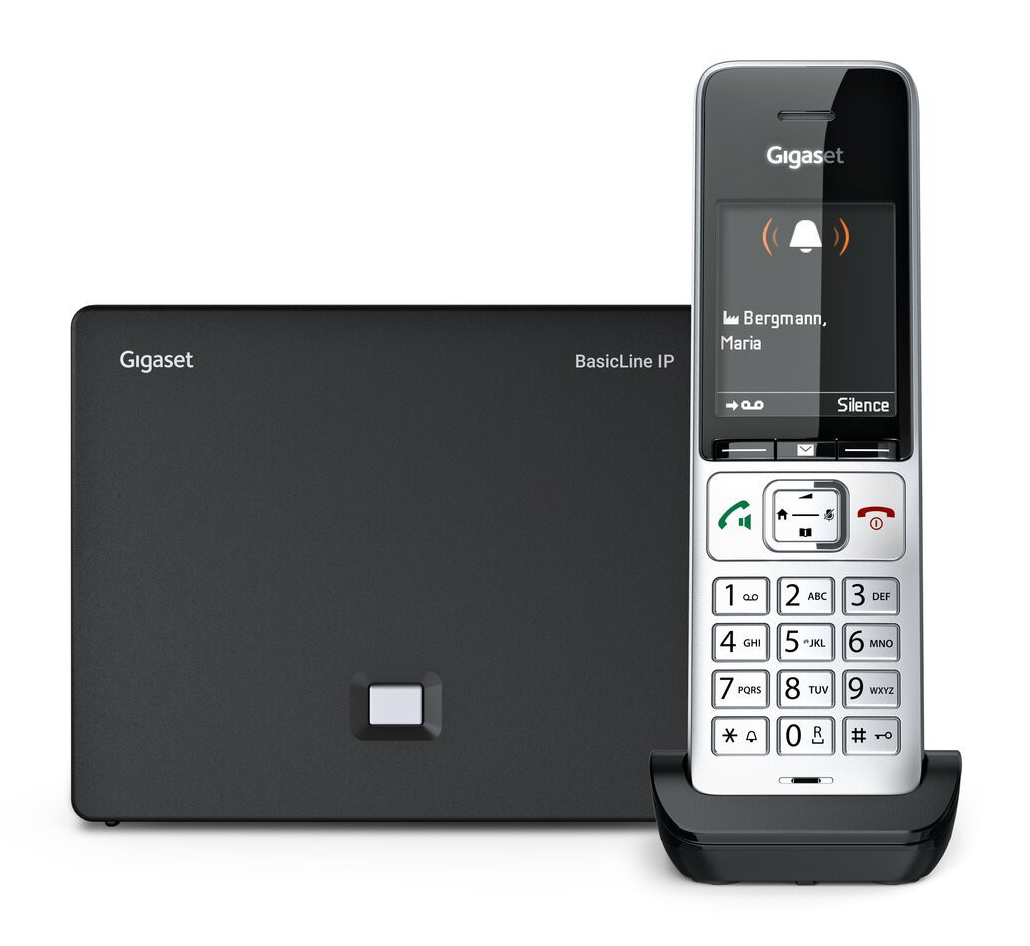 Telefon Gigaset BasicLine IP na ładowarce, obok stacja bazowa.