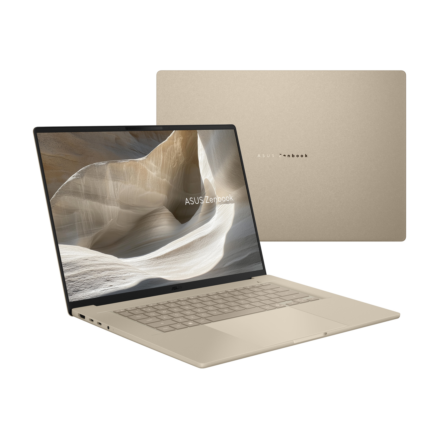 Un laptop Asus Zenbook dorato aperto mostra un paesaggio sullo schermo.