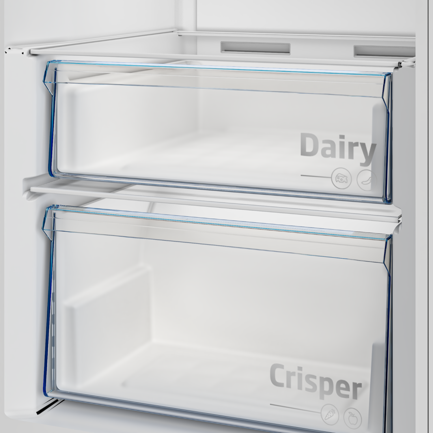 Dos cajones transparentes en un refrigerador blanco. Cajón superior "Dairy", inferior "Crisper".