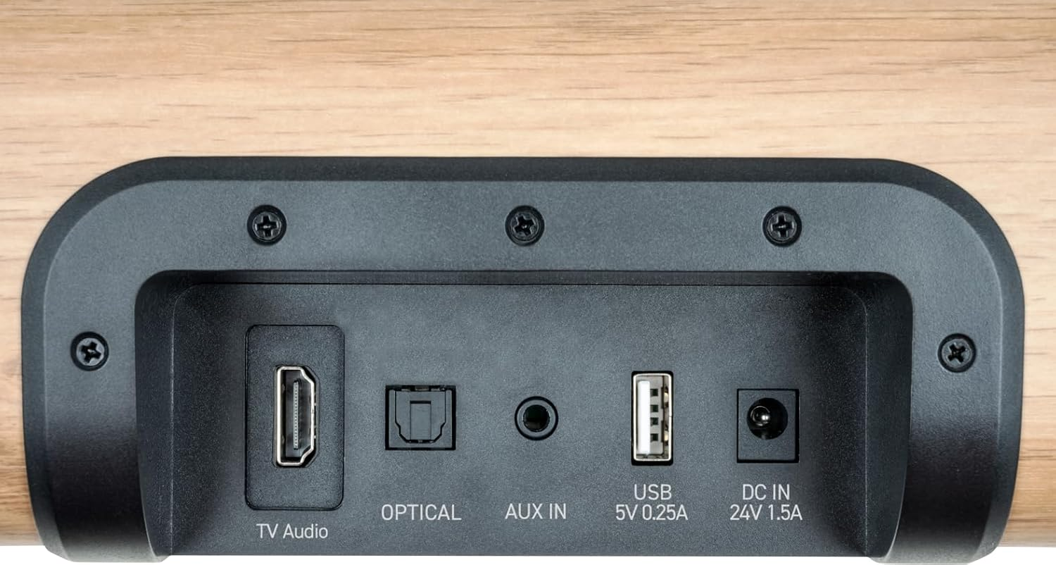 Panel trasero de un dispositivo mostrando puertos: HDMI, óptico, Aux, USB y DC IN.