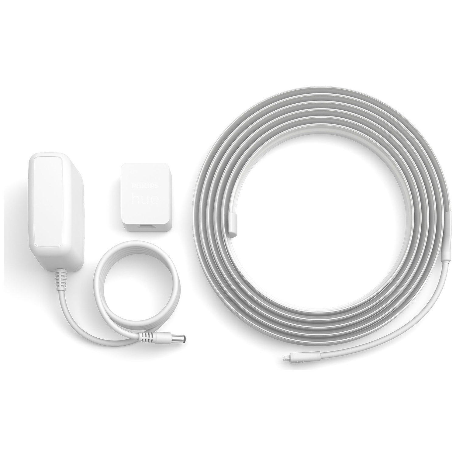 Vue de dessus d'un ruban lumineux Philips Hue blanc, d'un adaptateur secteur et d'un contrôleur disposés sur une surface blanche.