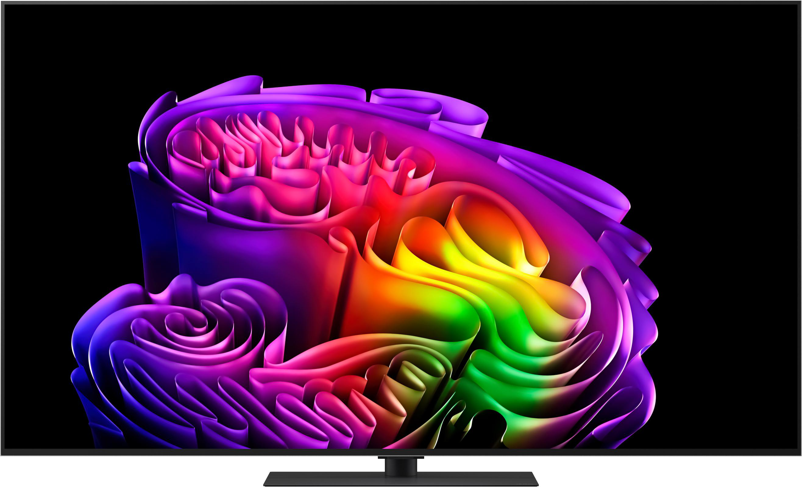 Ein Fernsehbildschirm zeigt eine abstrakte, wirbelnde Skulptur in Regenbogenfarben auf schwarzem Hintergrund.