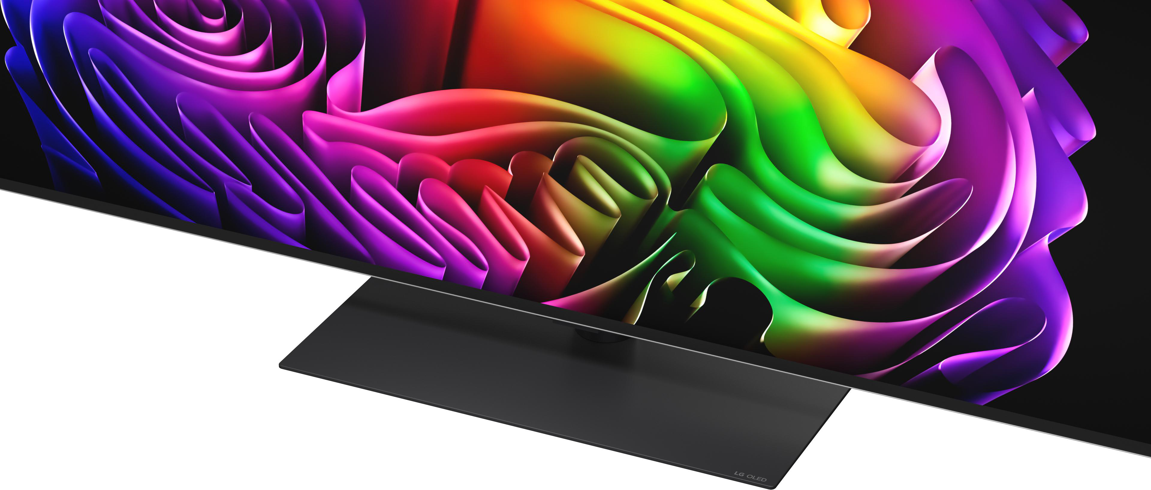 Ein moderner Fernseher mit einem bunten, abstrakten Hintergrund und einem schwarzen Sockel.