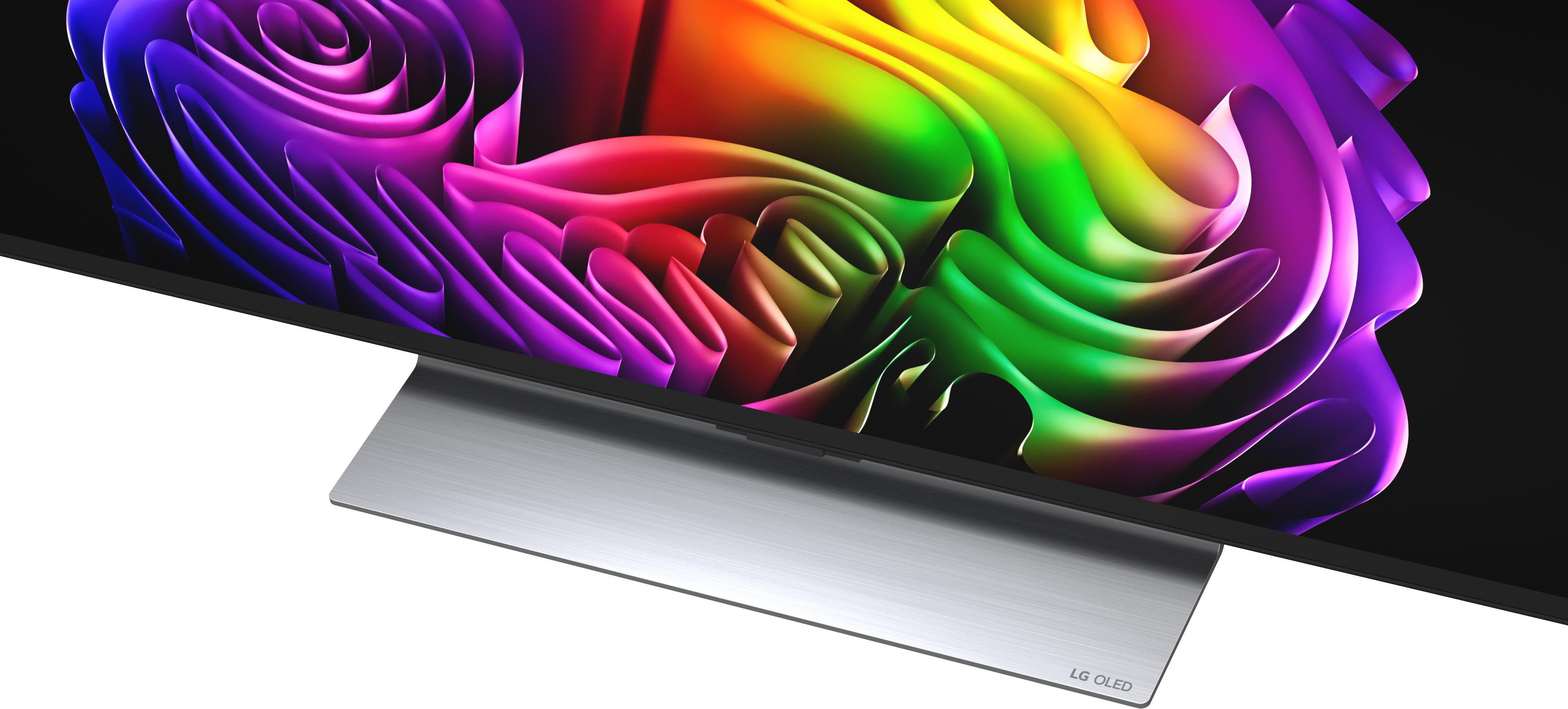 Nahaufnahme eines LG OLED-Fernsehers mit einem abstrakten, bunten Hintergrund.