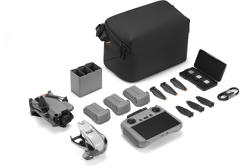 Szürke DJI Mini drónkészlet távirányítóval, akkumulátorokkal, légcsavarokkal és táskával.