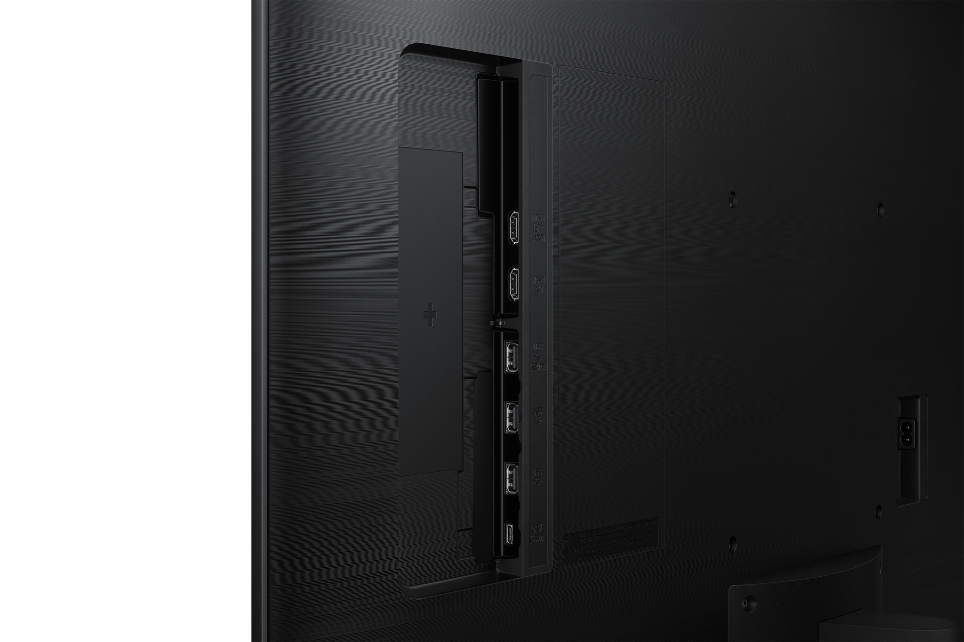Rückseite eines schwarzen Fernsehers mit Anschlüssen wie HDMI und USB.