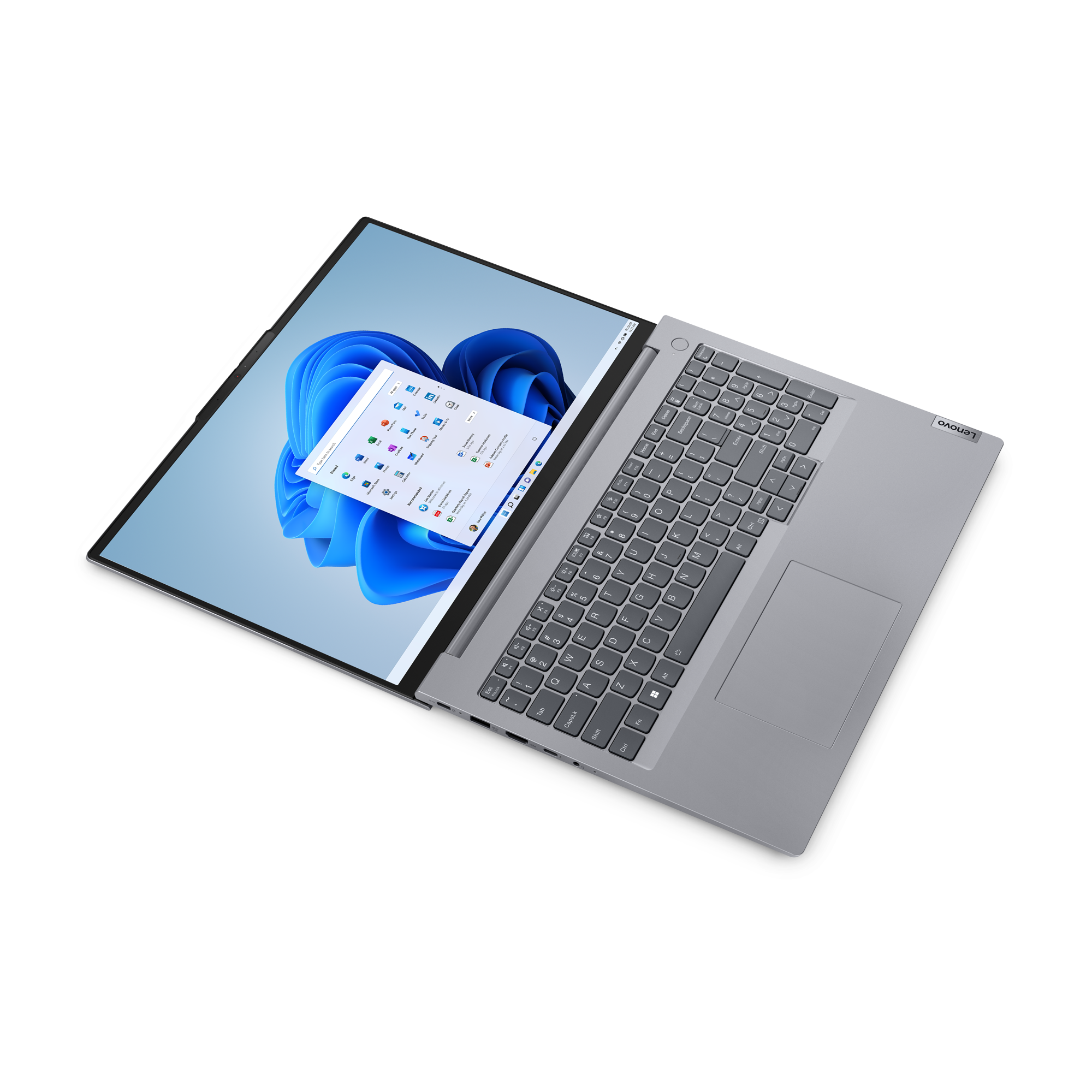 Szary laptop Lenovo z otwartym ekranem, na którym wyświetlany jest system Windows 11.