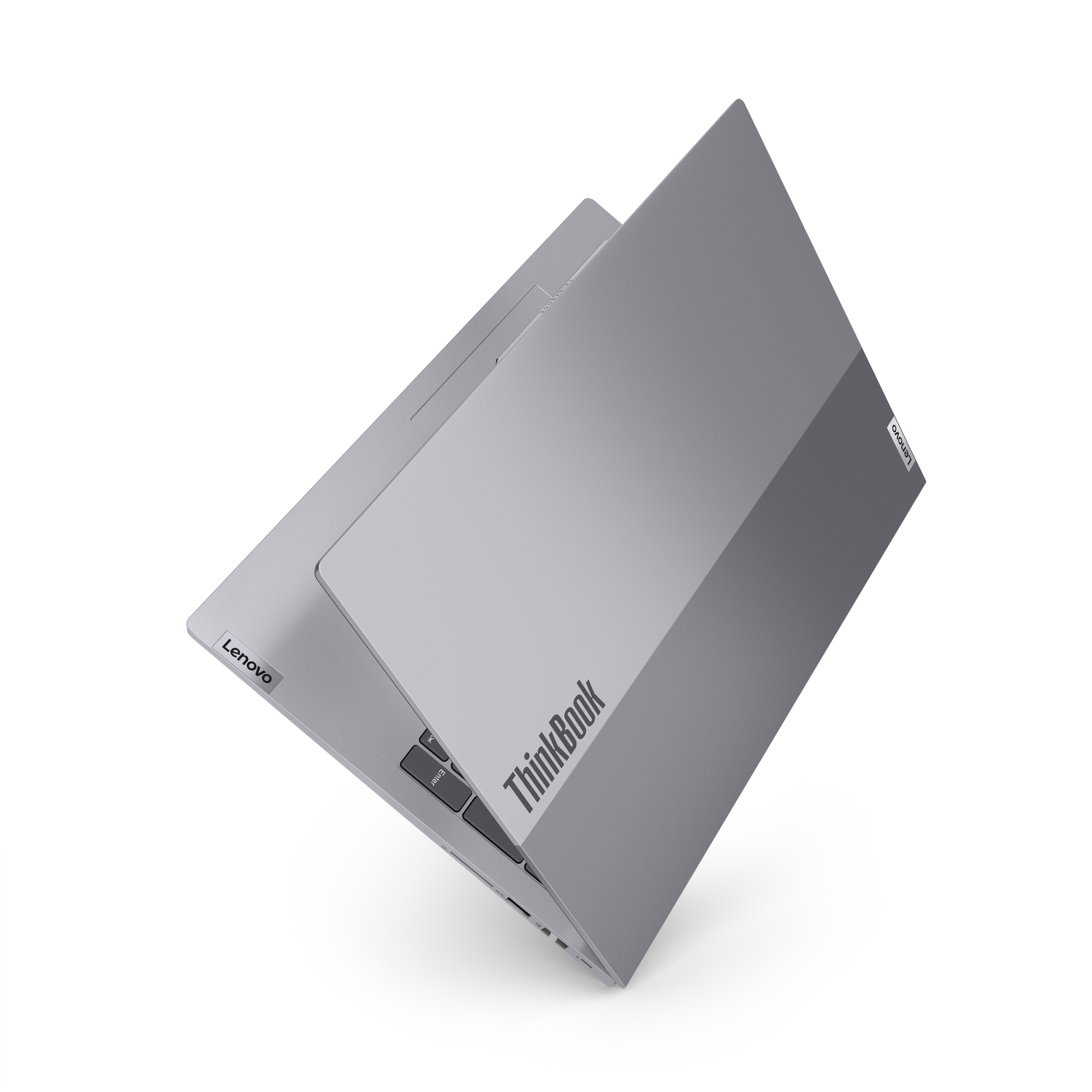Srebrny laptop Lenovo ThinkBook widoczny z góry na czarnym tle.