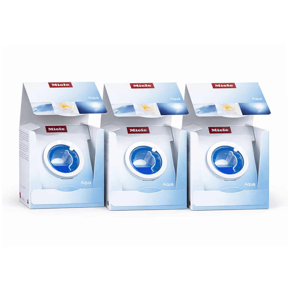 Tres cajas de detergente Miele Aqua una al lado de la otra, blancas con detalles azules.