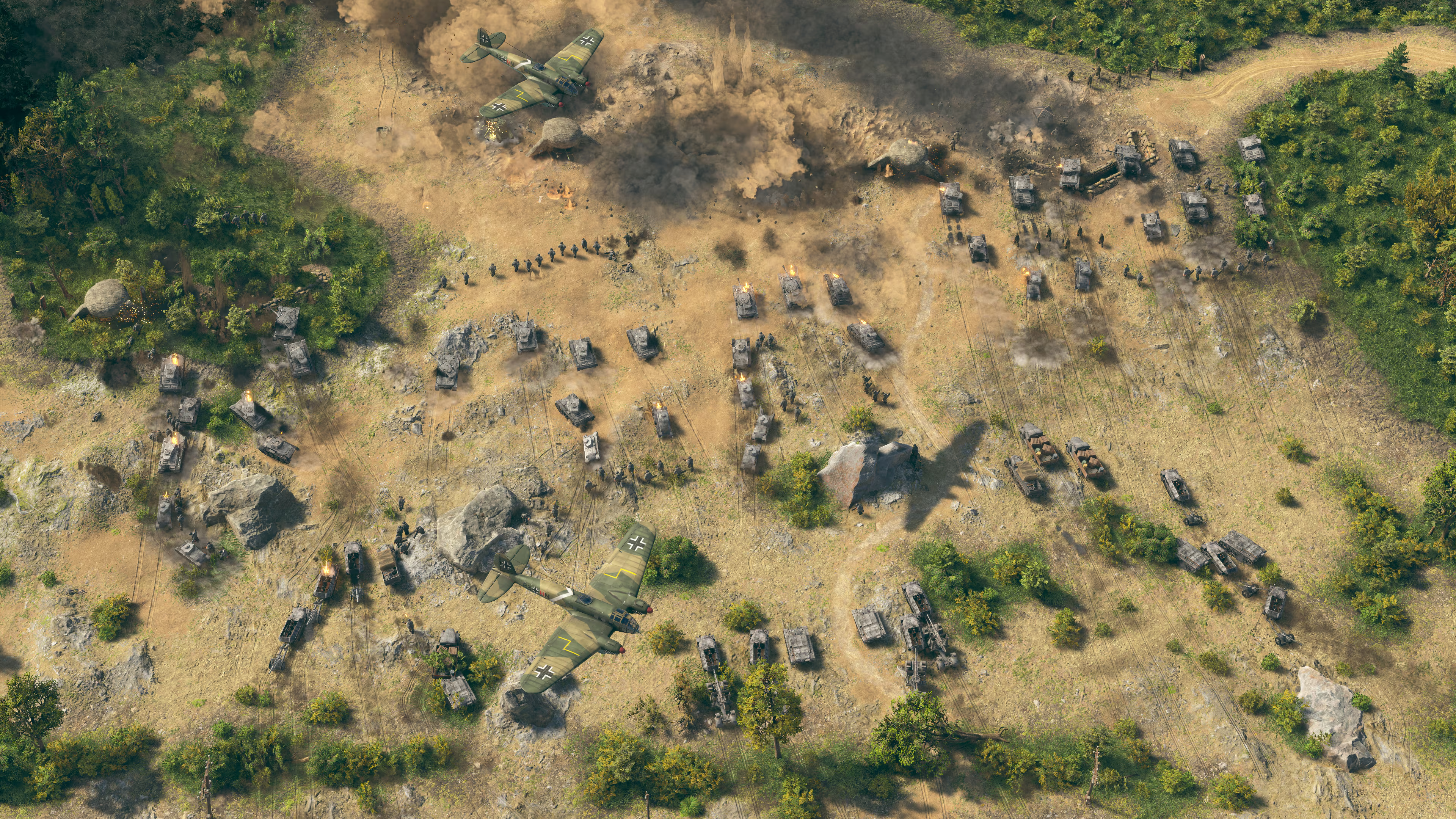Luftaufnahme eines Schlachtfelds mit Flugzeugen, Panzern und Soldaten im Kampf.
