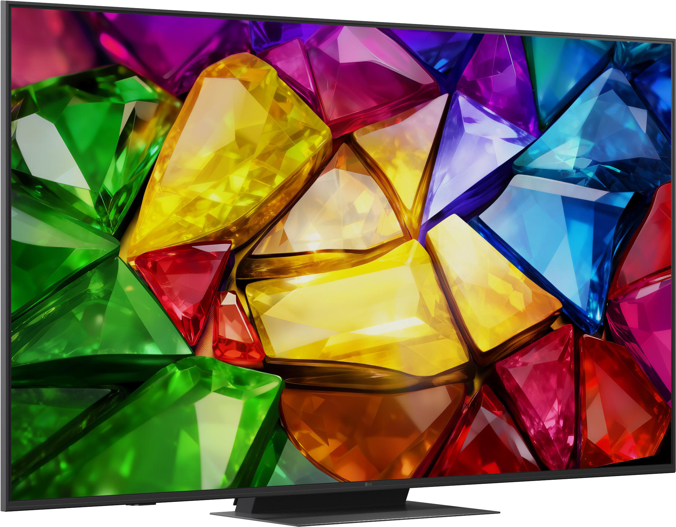 Ein Fernseher zeigt ein Kaleidoskop aus bunten Edelsteinen in Grün, Gelb, Rot und Blau.
