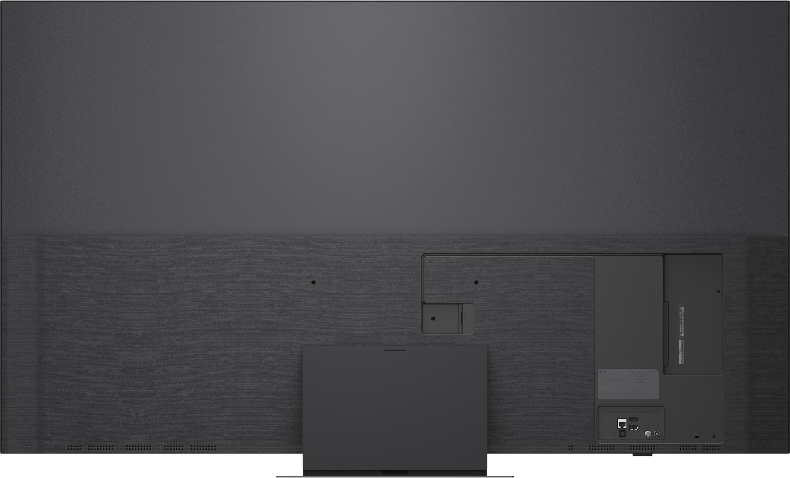 Rückseite eines dunklen Fernsehers mit Anschlüssen und Abdeckungen.
