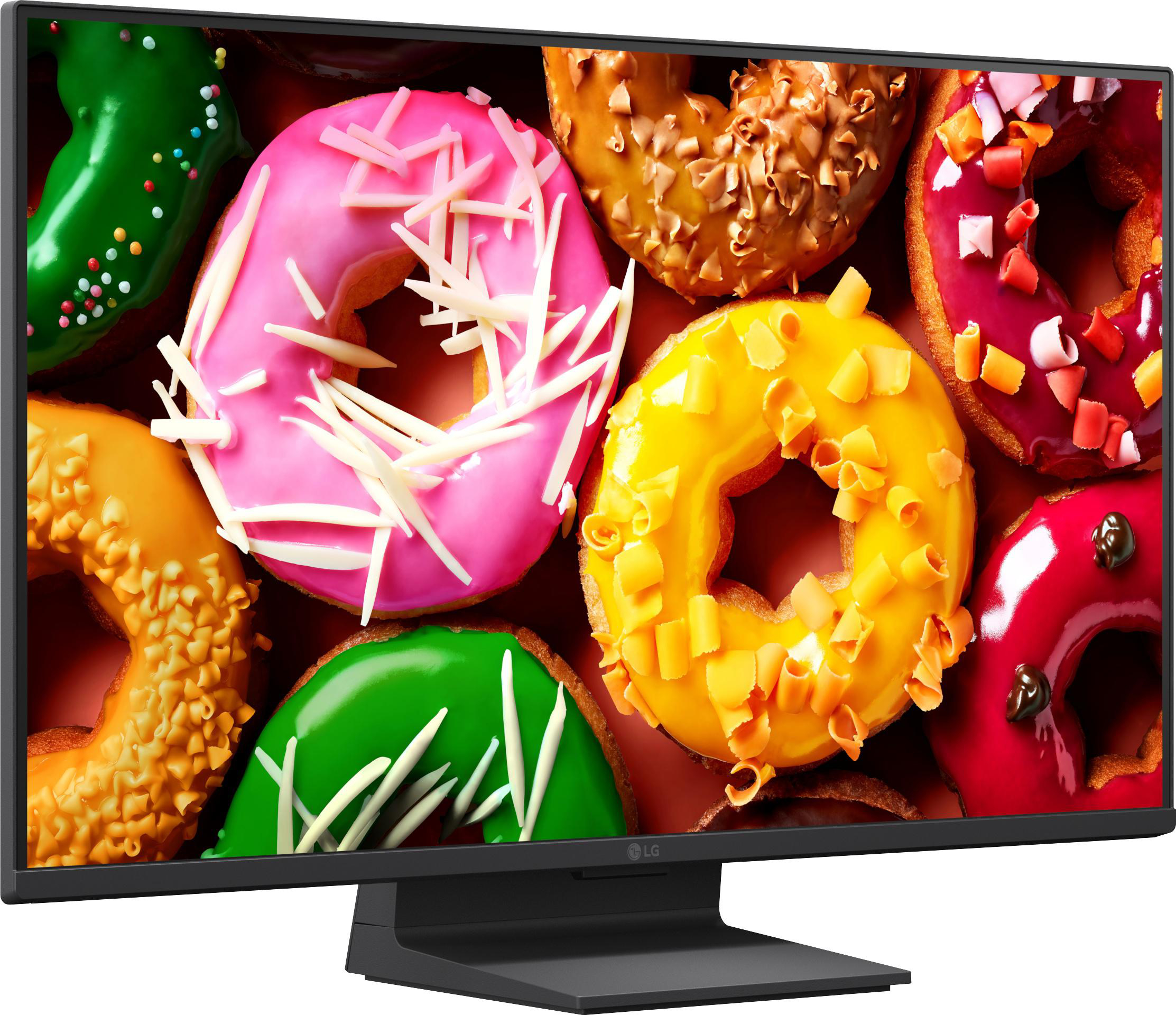 Nahaufnahme eines Monitors mit bunten Donuts: pink, gelb, rot und grün.