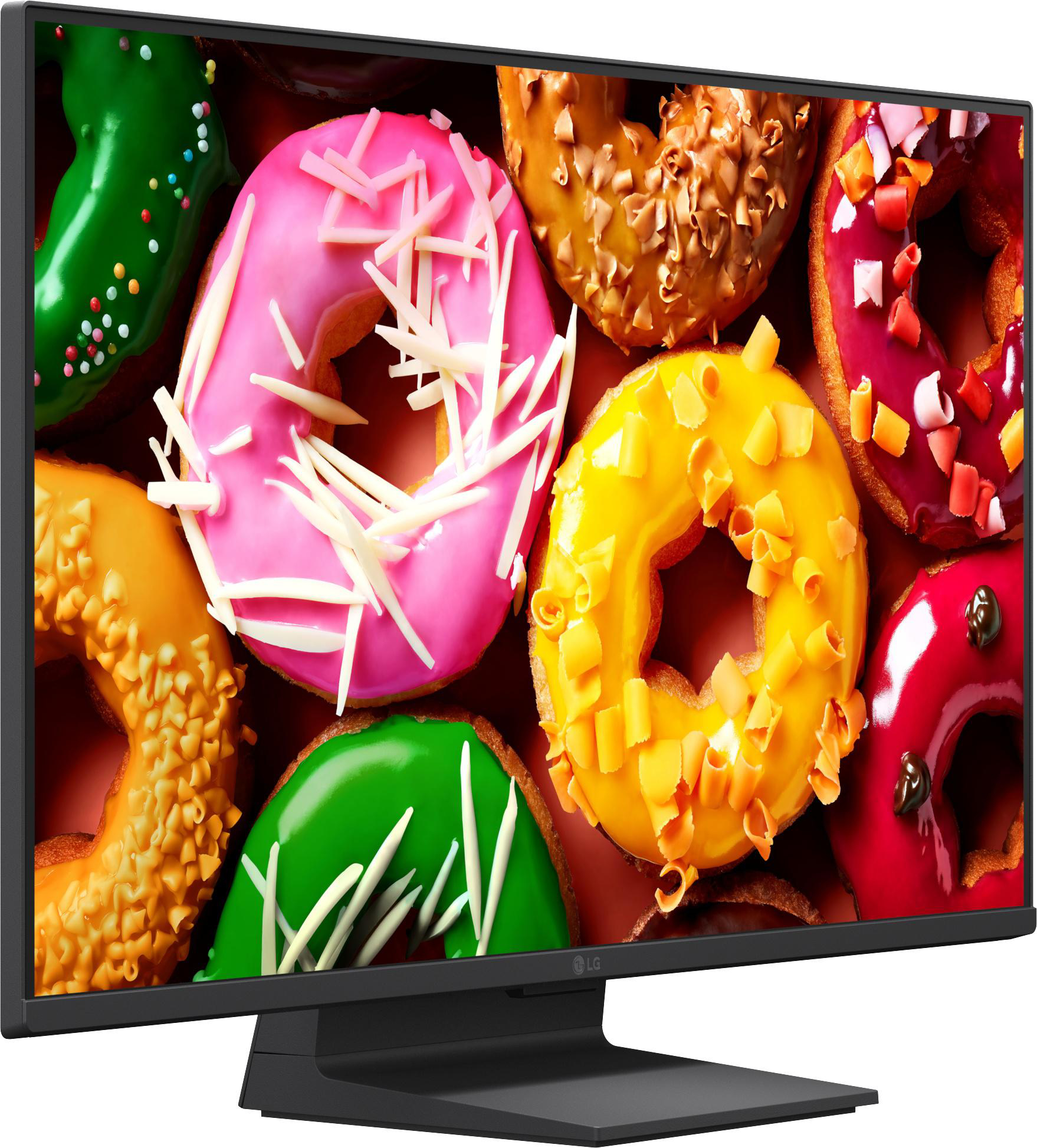 Ein Monitor zeigt eine Nahaufnahme von bunten Donuts mit verschiedenen Toppings.