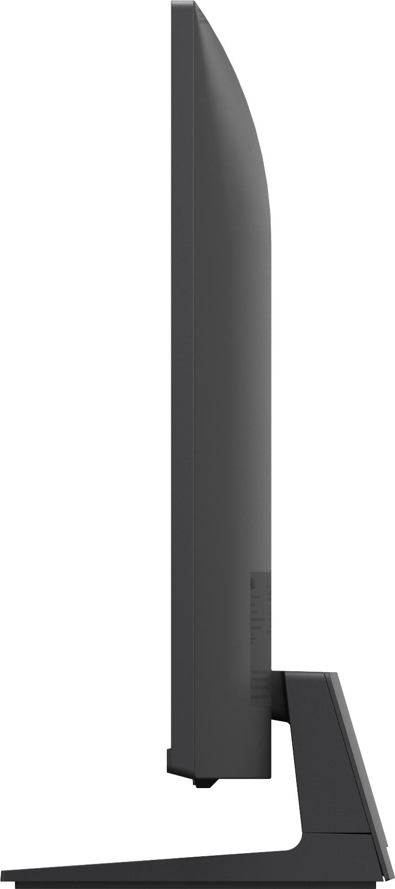 Grauer Computermonitor von der Seite mit Ständer auf weißem Hintergrund.