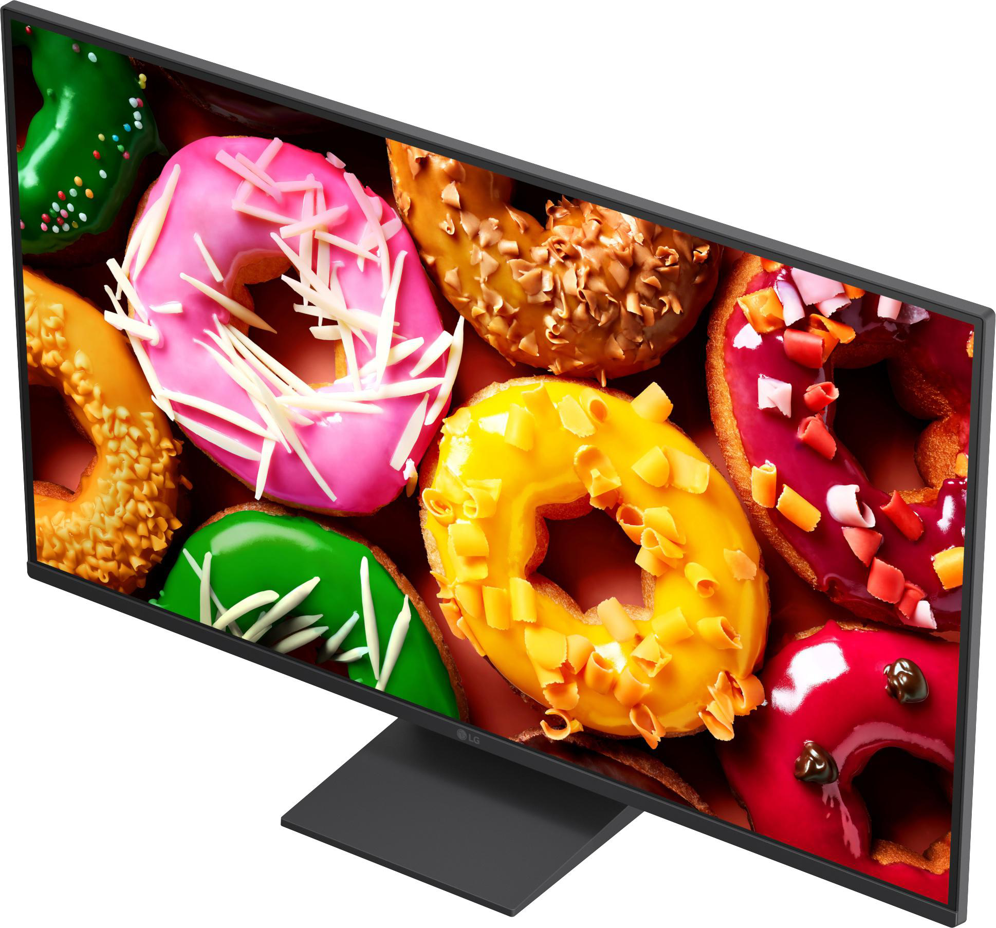 Ein Monitor zeigt bunte Donuts mit Zuckerguss und Streuseln.