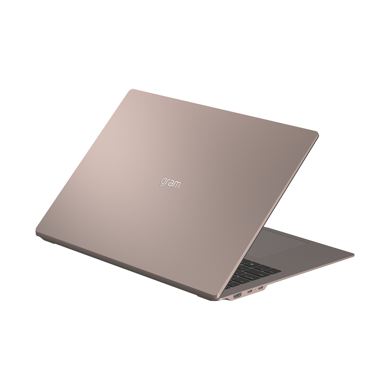 Un laptop chiuso, marrone chiaro, con il logo 'gram' sul coperchio.