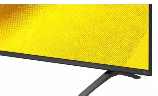 Sarı desenli ekrana ve siyah standa sahip bir TV'nin parçası.