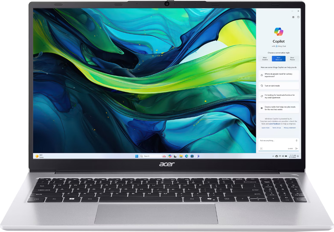 Ezüst Acer laptop színes háttérképpel és Copilot ablak.