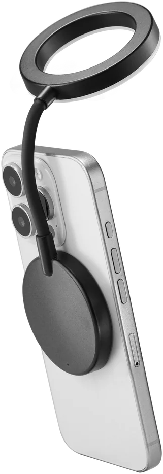Un accessorio ad anello luminoso nero su uno smartphone bianco.