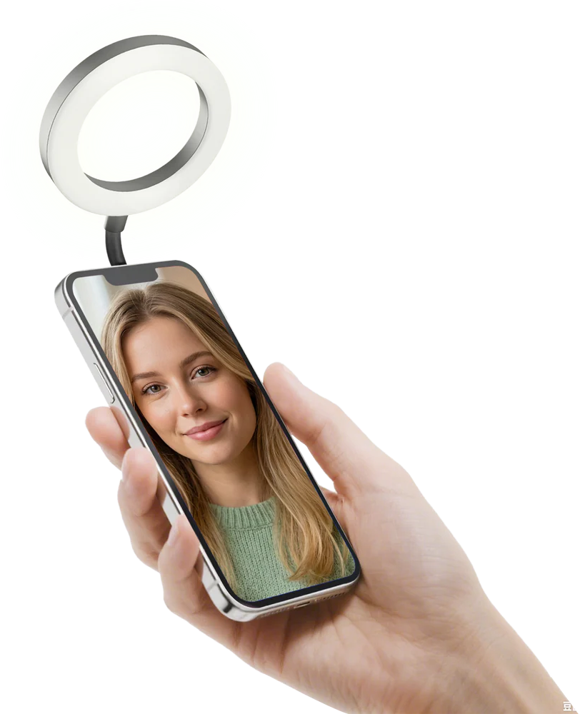 Una mano tiene uno smartphone con il ritratto di una donna; una luce ad anello illuminata.