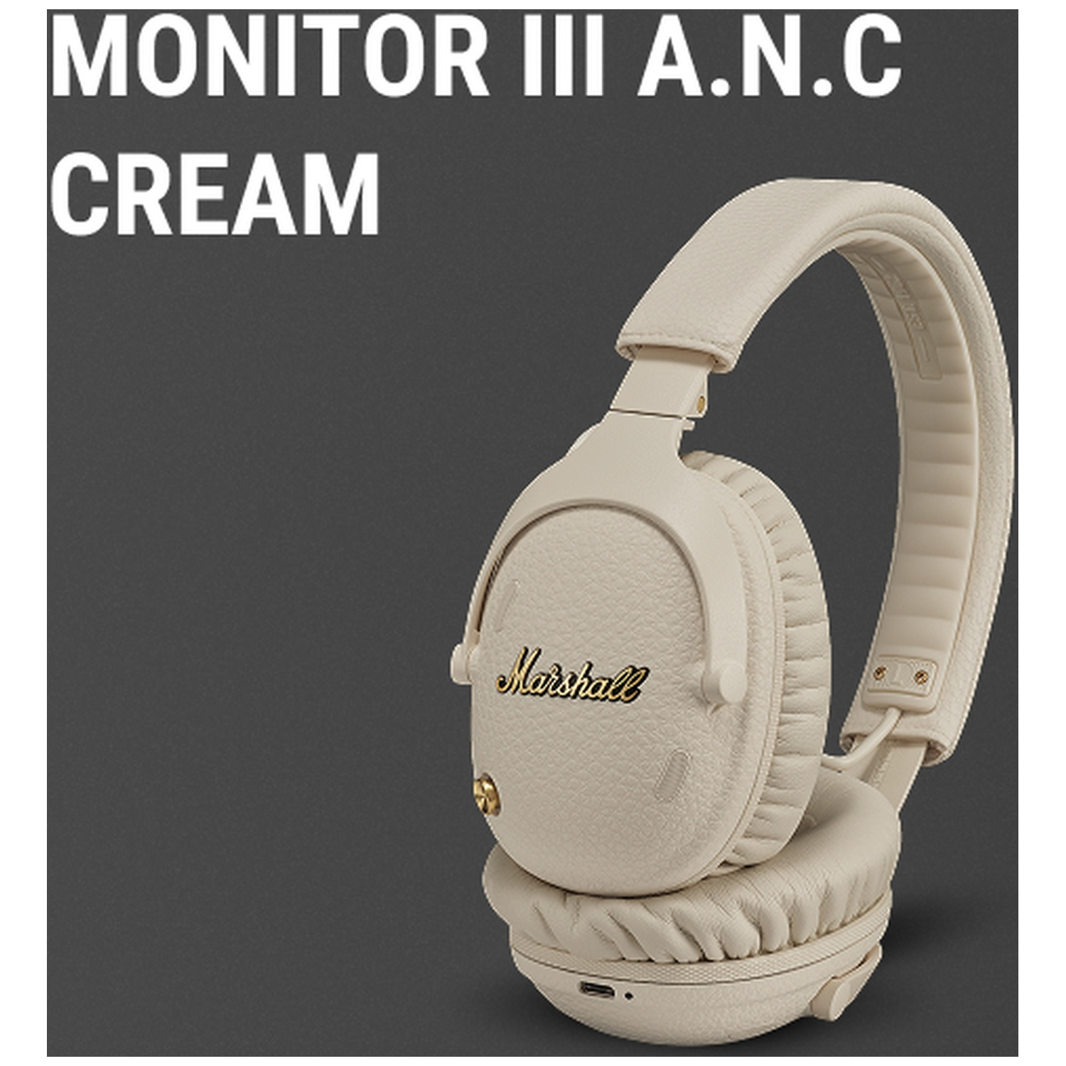 Casque Marshall crème avec logo doré sur fond sombre.