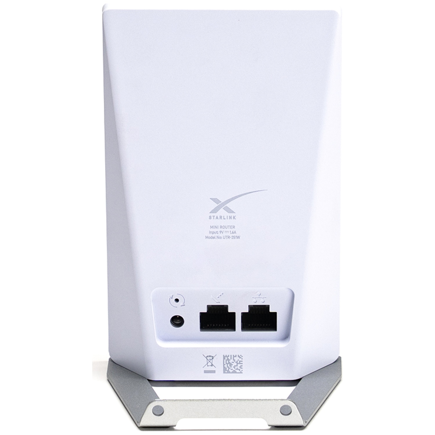 Un routeur Starlink blanc avec deux ports Ethernet et un port d'alimentation rond.