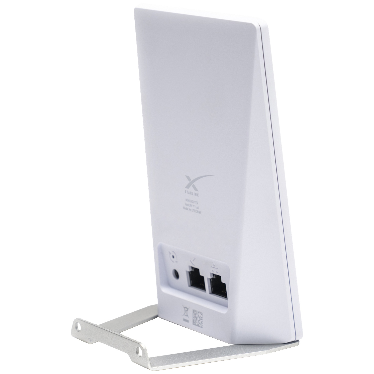 Un mini routeur Starlink blanc sur un support argenté avec des ports à l'arrière.