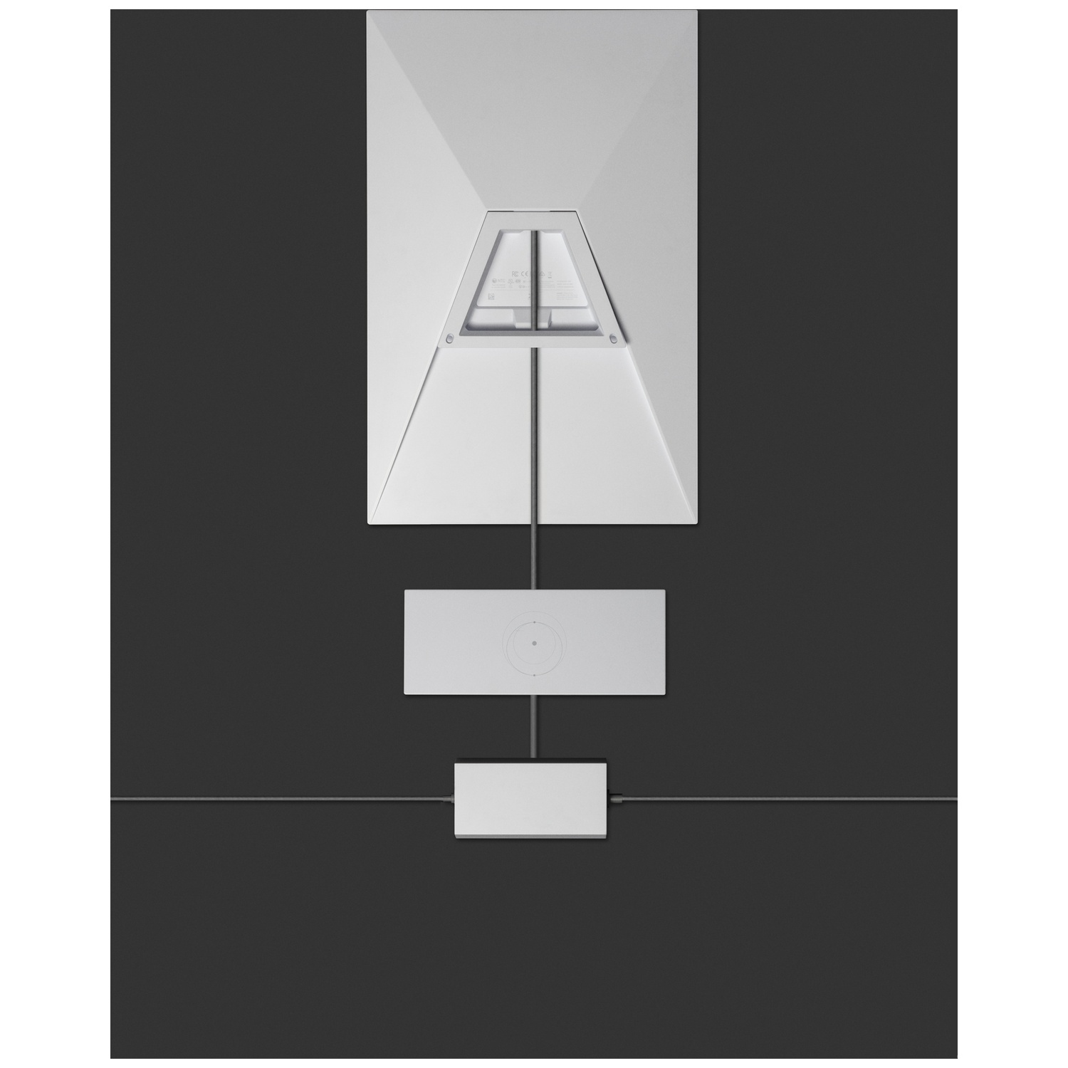 Een wit modulair verlichtingssysteem met geometrische vormen tegen een donkergrijze achtergrond.