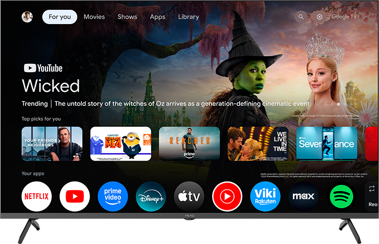 Google TV felület "Wicked" promóval, zöld boszorkány és szőke nő. Alatta appok.