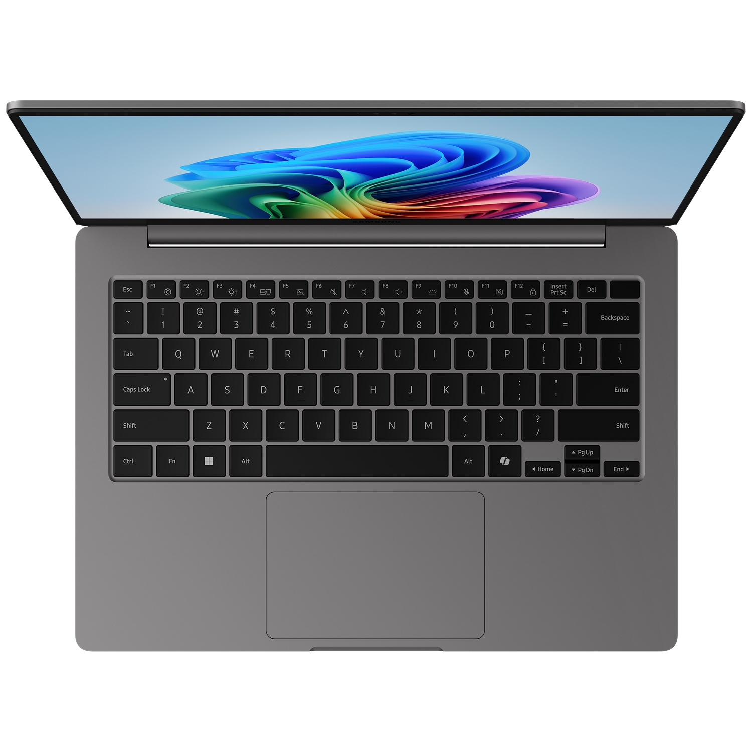 Un ordinateur portable gris est ouvert, affichant un fond d'écran abstrait coloré sur son écran et un clavier complet.