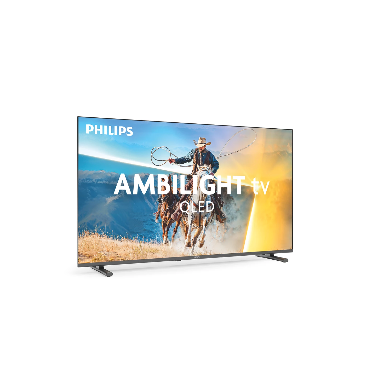 Un televisor Philips Ambilight muestra vaqueros a caballo con lazos en un paisaje desértico.