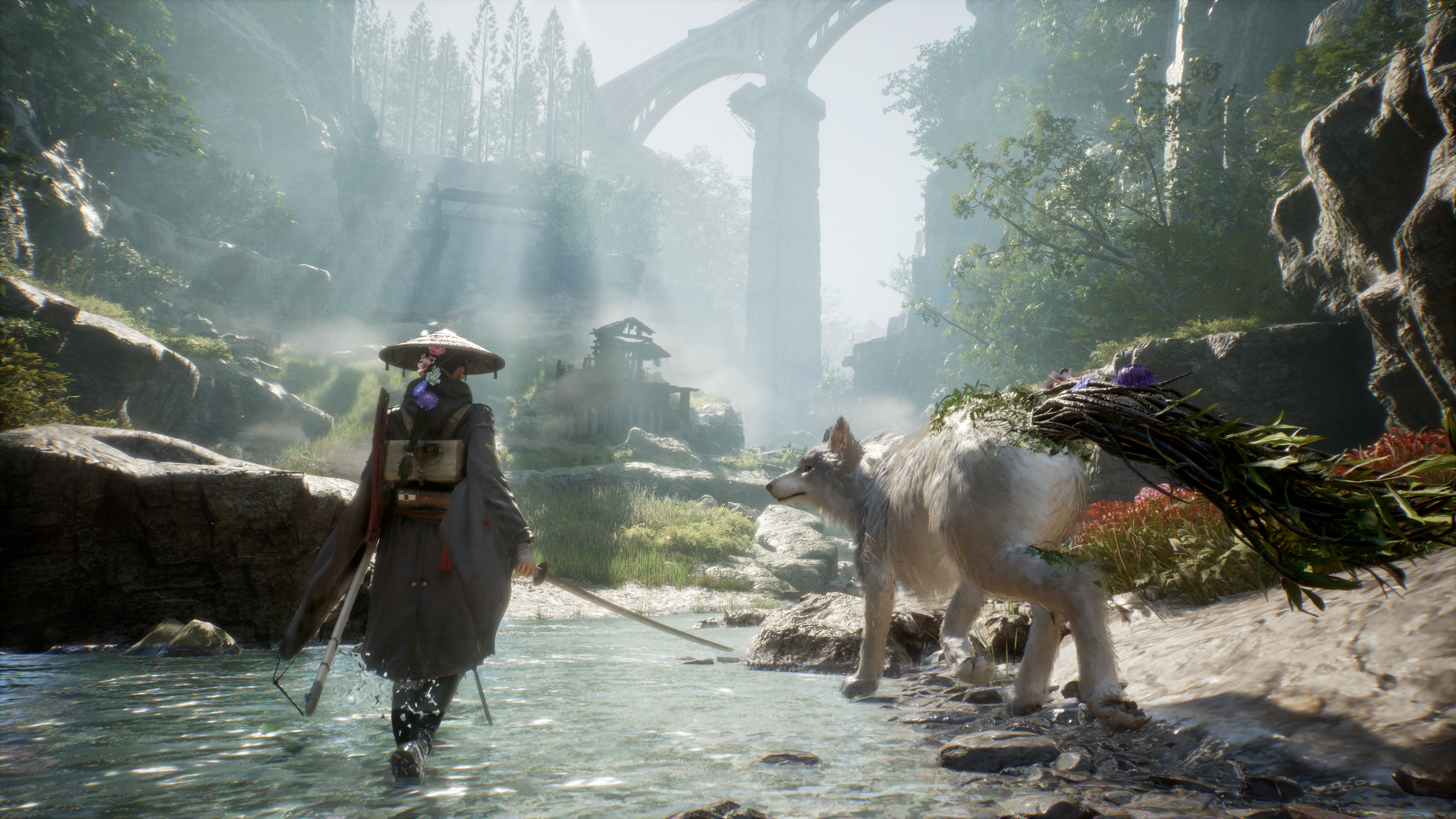 Eine Person mit Hut und ein Wolf in einer nebligen Landschaft mit einer Brücke.