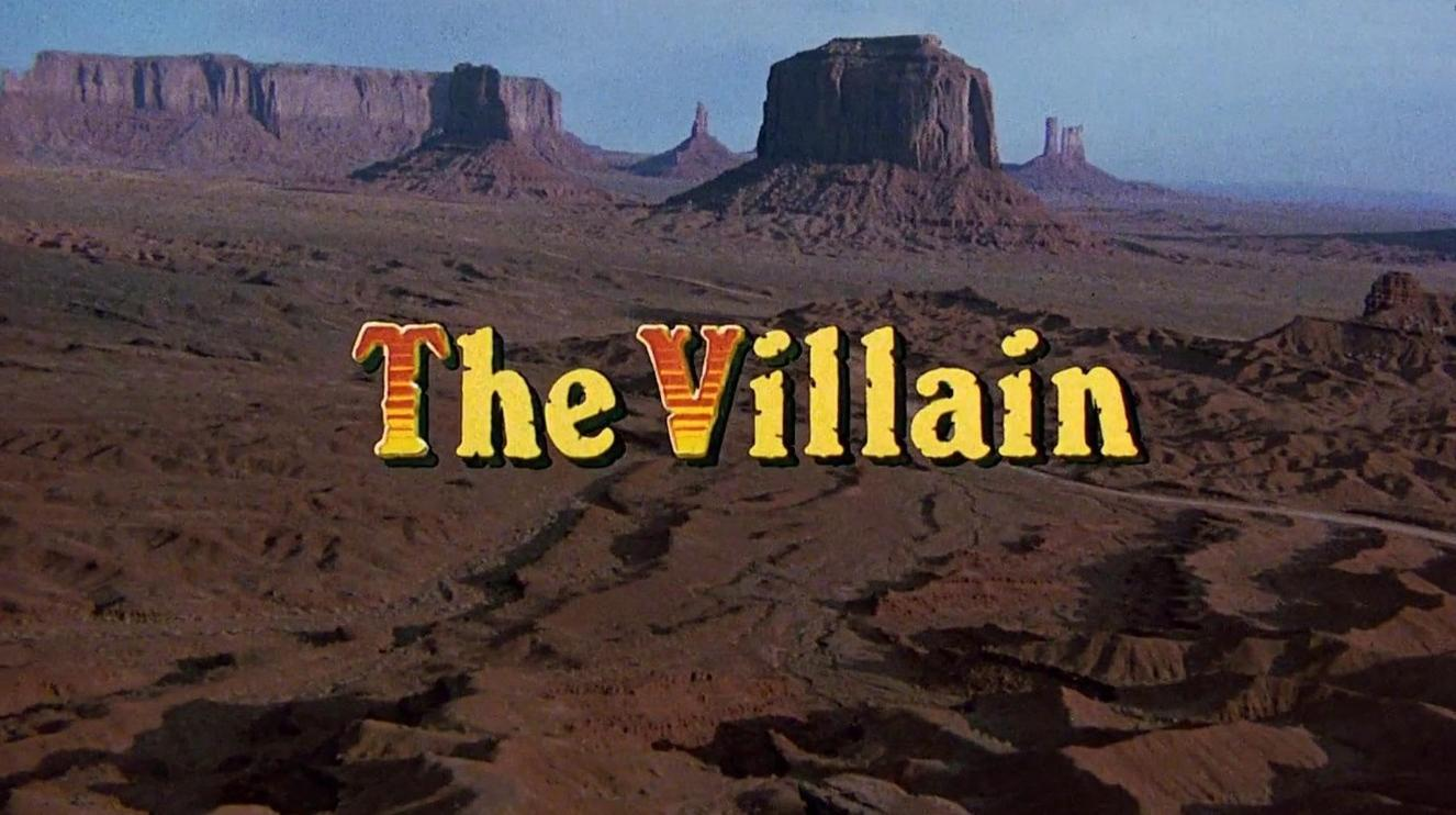 Die Titelkarte "The Villain" vor einer Wüstenlandschaft mit Tafelbergen.
