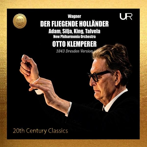 Ein Dirigent mit Brille dirigiert, der Titel lautet Der Fliegende Holländer.
