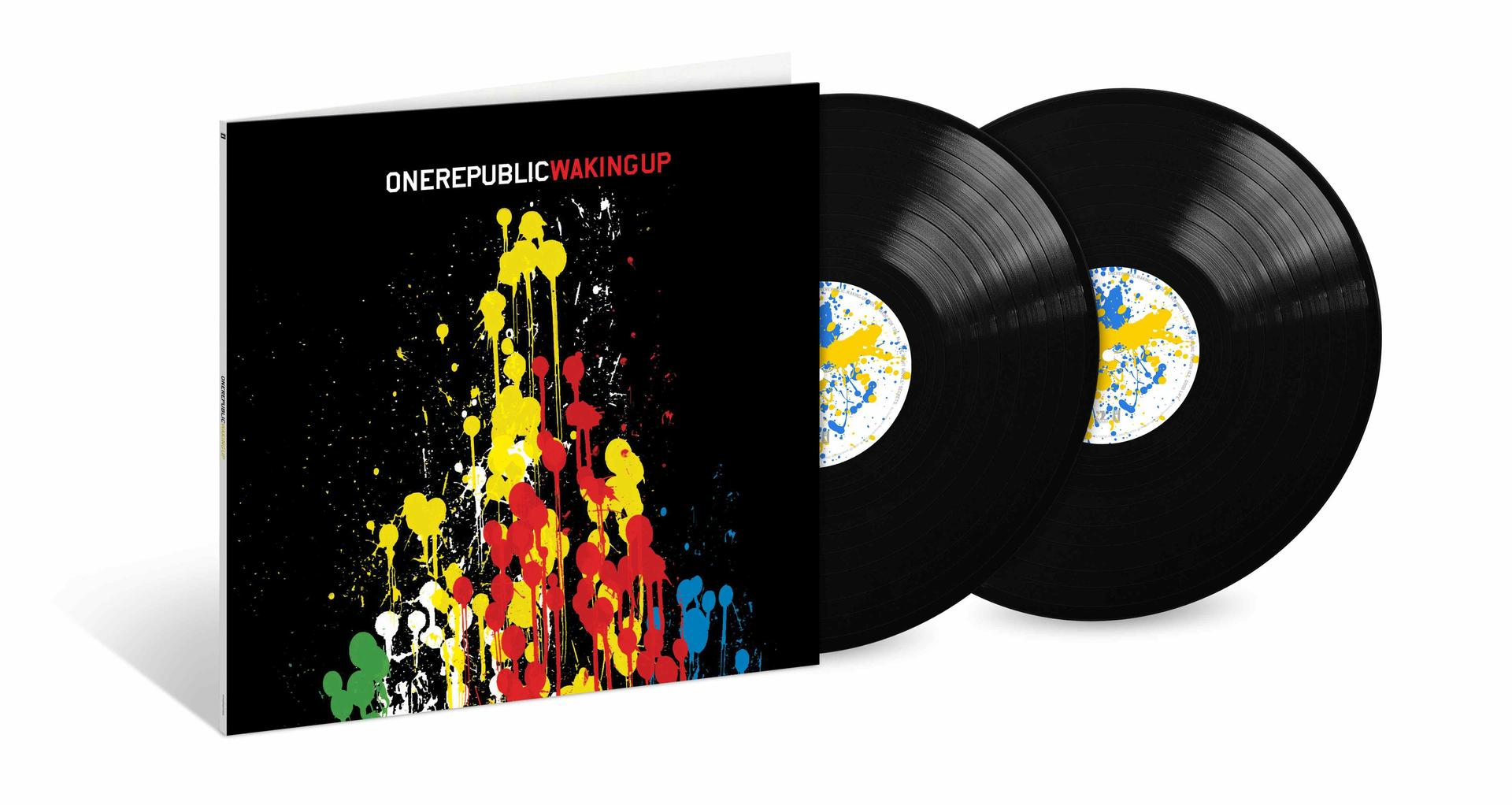 OneRepublic Waking Up Albumcover mit Farbspritzern und zwei Schallplatten.