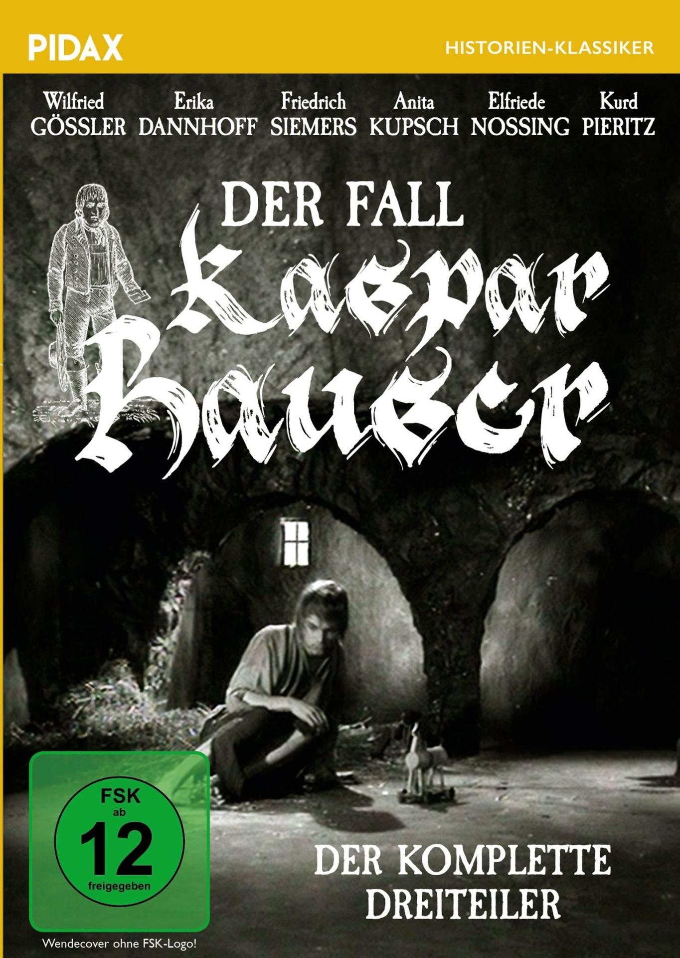 Filmplakat: Mann kniet vor einem Spielzeugpferd, im Hintergrund eine Scheune.