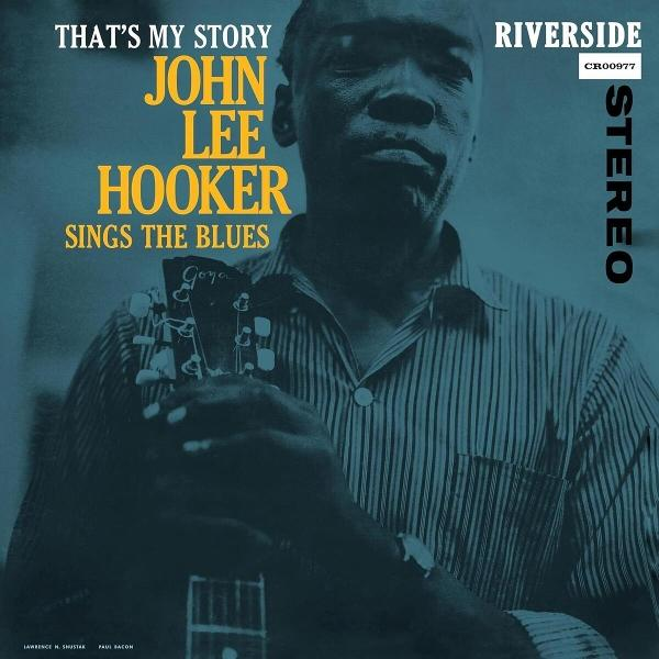 John Lee Hooker singt Blues, hält Gitarre. Albumcover mit Texten.